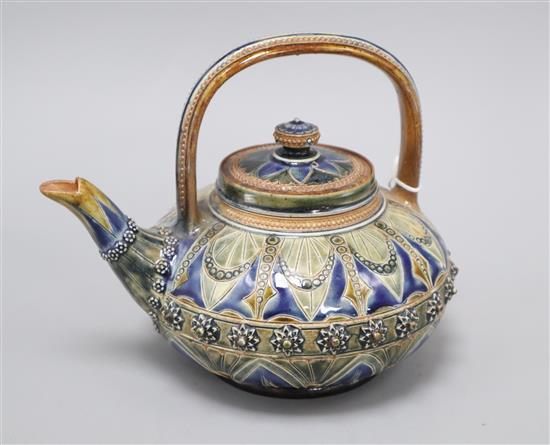 A Doulton Lambeth compressed globular teapot and cover, by Louisa E Edwards, dated 1877, Length 20cm